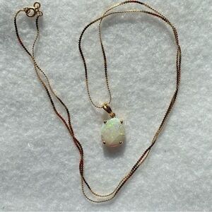Macy’s 14k yellow gold white opal pendant on serpentine chain necklace